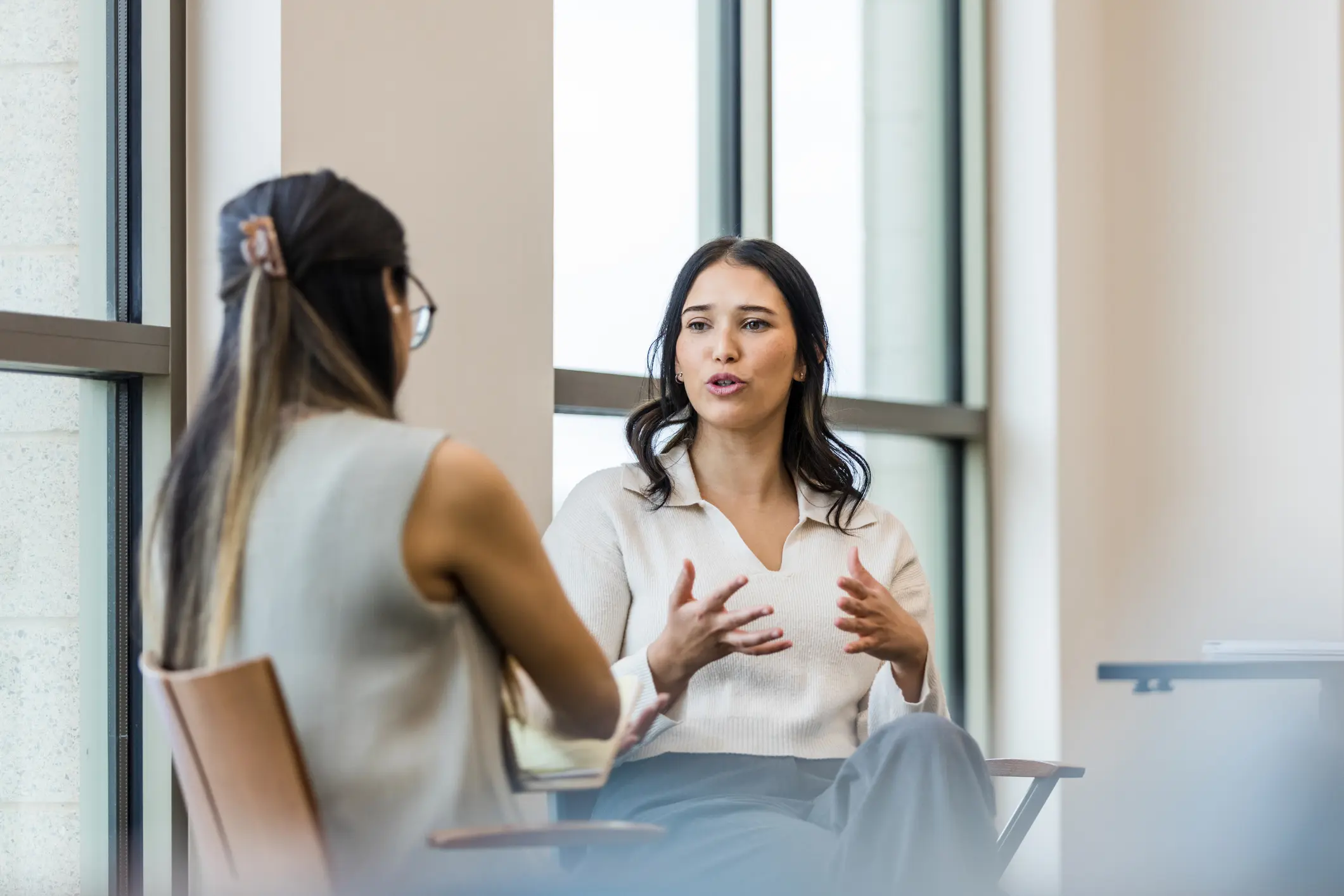 Women discussing in an office setting