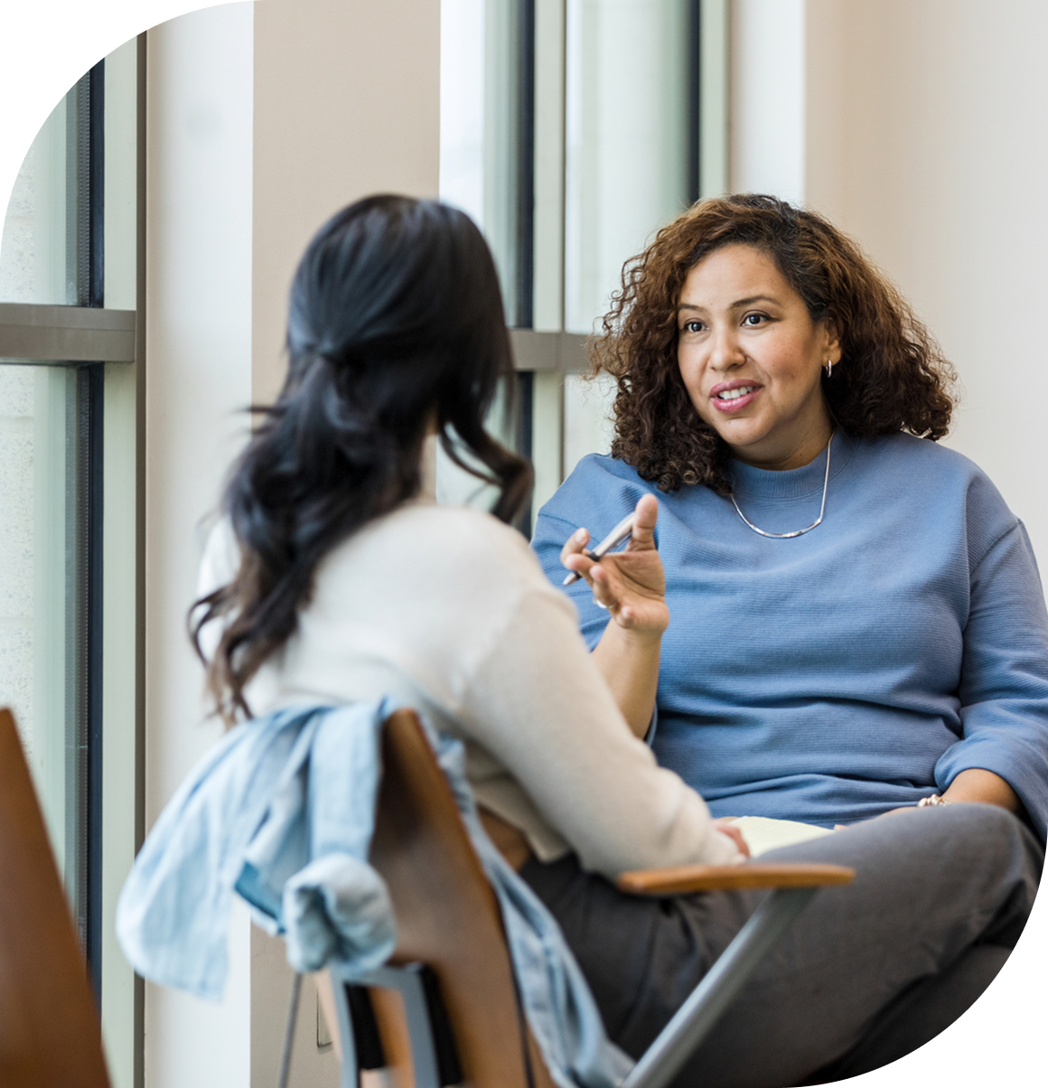 Casual meeting between two women indoors
