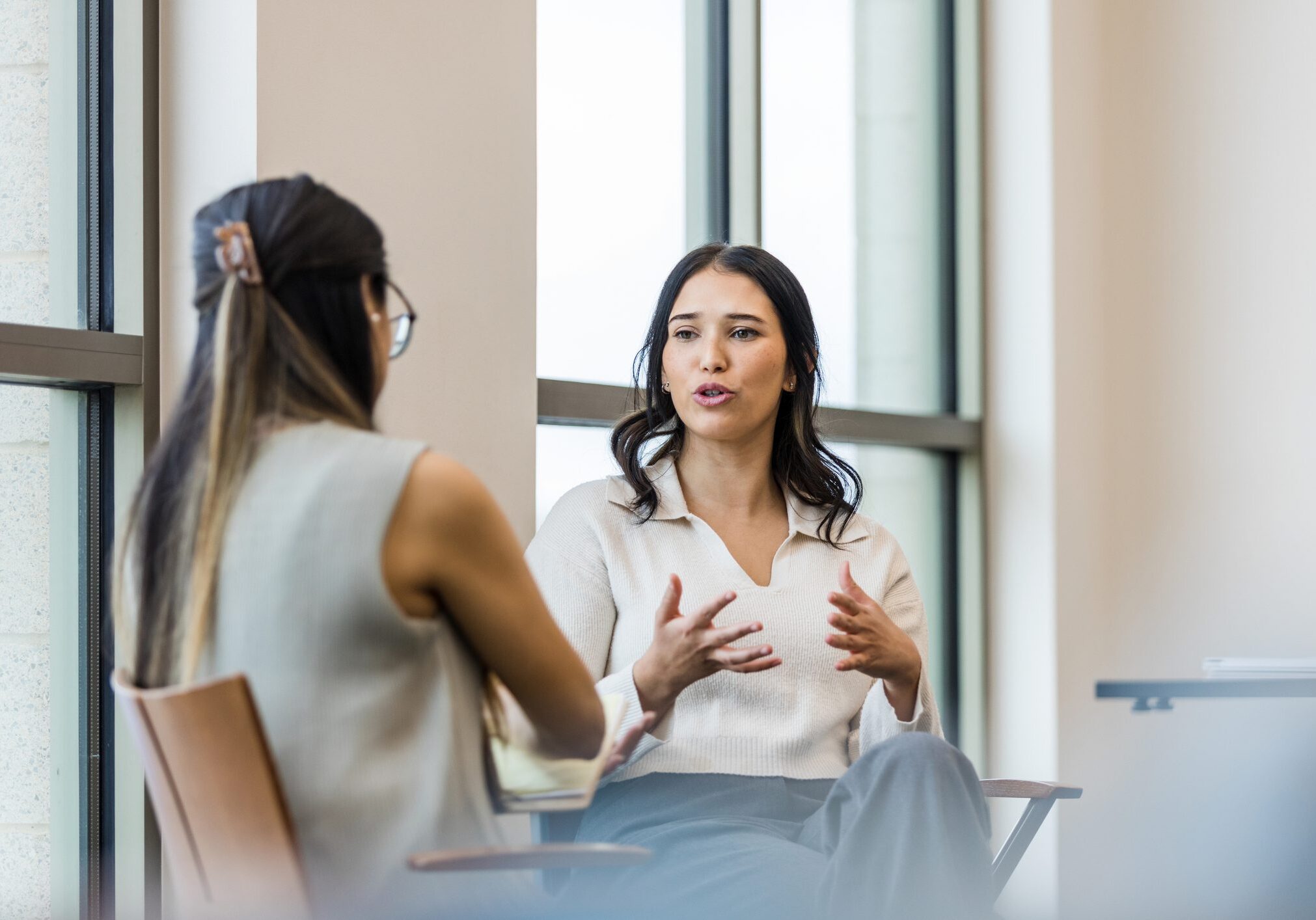Women discussing in an office setting